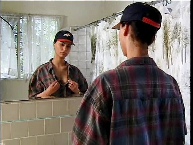Teen Seduction: Hot brunette in boy's clothes caress herself.