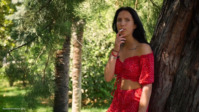 Russian Smokers: Seductive Russian Beauty Smoking Slim Cigarette Outdoors