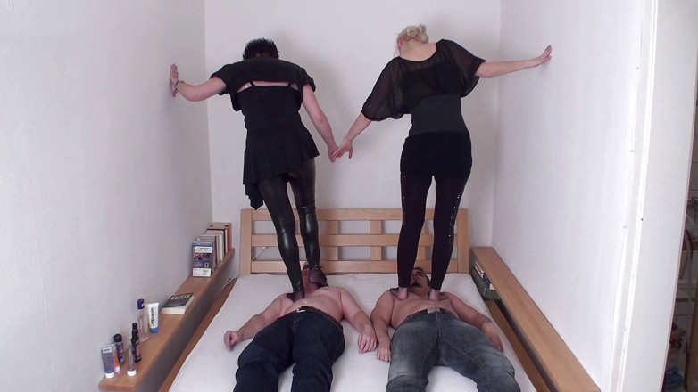 Femdom Austria: Brunette and blonde are trampling on their slaves
