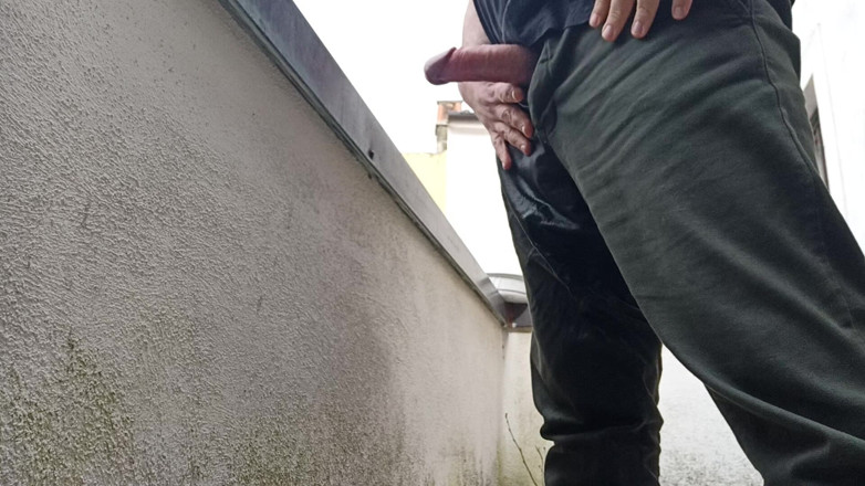 Kinky Guy: Peeing on the Balcony While Watching People Outside